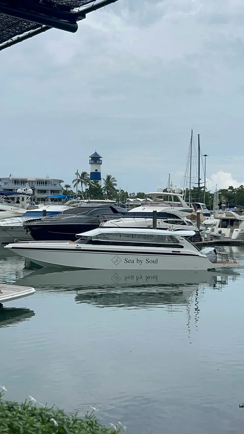 Private speedboat anchored in a hidden lagoon during an island hopping charter in Thailand